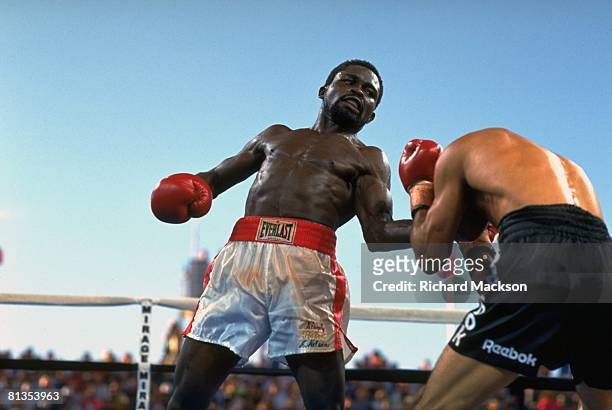 Boxing: WBC Super Featherweight Title, Azumah Nelson in action, throwing punch vs Jeff Fenech at The Mirage, Las Vegas, NV 6/28/1991