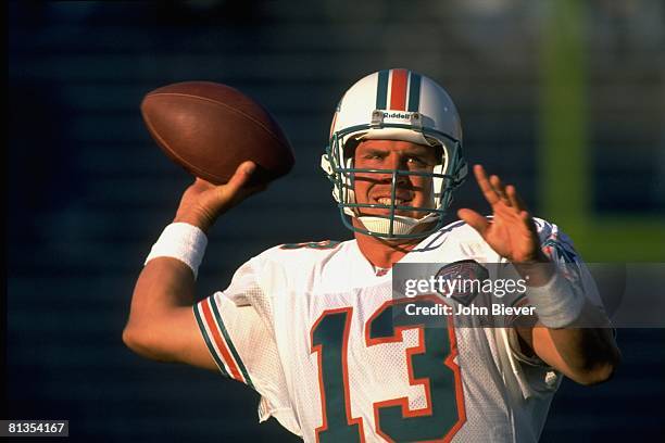 Football: Closeup of Miami Dolphins QB Dan Marino in action, warming up before game vs New England Patriots, Foxboro, MA