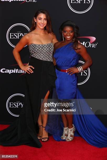 Olympic gymnasts Aly Raisman and Simone Biles arrive at the 2017 ESPYS at Microsoft Theater on July 12, 2017 in Los Angeles, California.