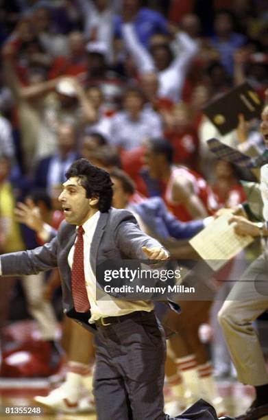 College Basketball: NCAA Final Four, North Carolina State coach Jim Valvano victorious, running onto court after winning championship game vs...