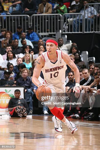 Mike Bibby of the Atlanta Hawks moves the ball against the Philadelphia 76ers during the game at Philips Arena on April 4, 2008 in Atlanta, Georgia....