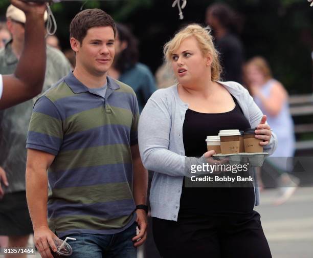 Adam Devine and Rebel Wilson on the movie set of "Isn't It Romantic" in Washington Square Park on July 12, 2017 in New York City.