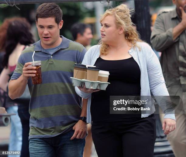 Adam Devine and Rebel Wilson on the movie set of "Isn't It Romantic" in Washington Square Park on July 12, 2017 in New York City.