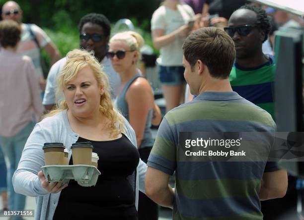 Adam Devine and Rebel Wilson on the movie set of "Isn't It Romantic" in Washington Square Park on July 12, 2017 in New York City.