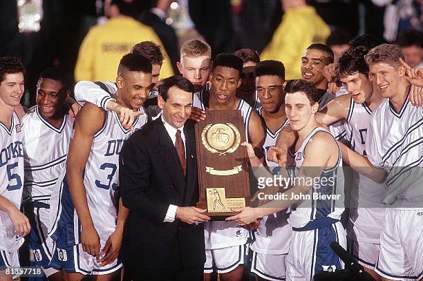 College Basketball: NCAA Finals, Duke coach Mike Krzyzewski and Bobby Hurley victorious with trophy after winning game vs Kansas, Indianapolis, IN...