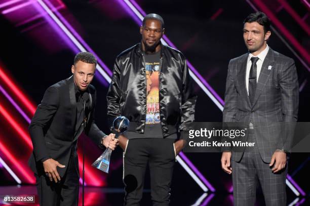 Players Steph Curry, Kevin Durant and Zaza Pachulia accept the Best Team award on behalf of the NBA champion Golden State Warriors onstage at The...