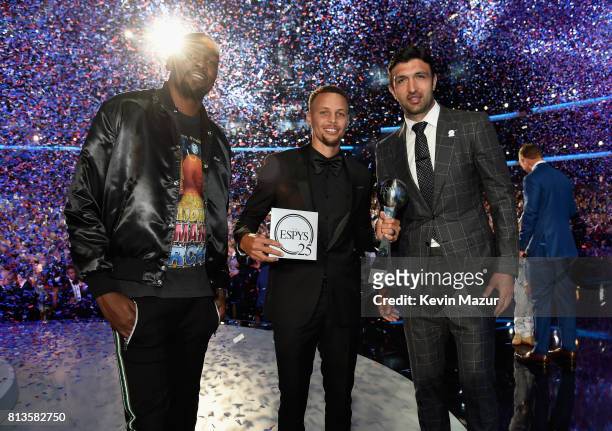 Players Kevin Durant, Steph Curry, and Zaza Pachulia accept the Best Team award on behalf of the NBA champion Golden State Warriors onstage at The...