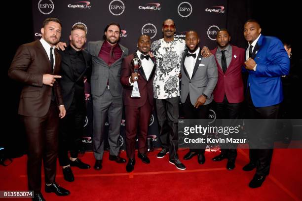 Rapper Snoop Dogg poses with New England Patriots players, winners of the Best Game award for Super Bowl LI , at The 2017 ESPYS at Microsoft Theater...