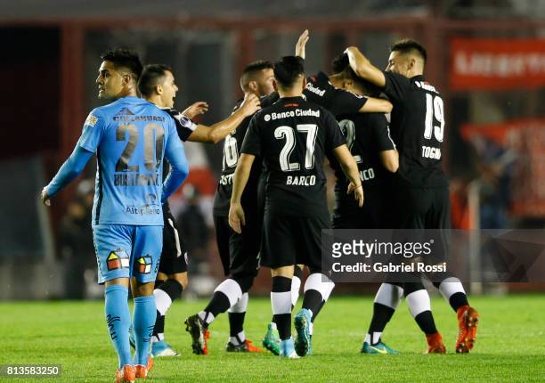 Alan Javier Franco of Independiente celebrates with teammates after scoring the first goal of his team during the first leg match between...
