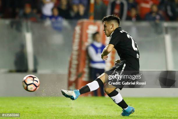 Ezequiel Barco of Independiente kicks the ball to score the second goal of his team during the first leg match between Independiente and Deportes...