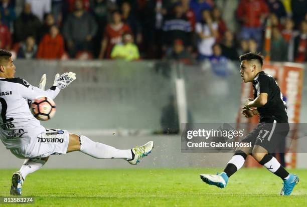 Ezequiel Barco of Independiente kicks the ball to score the second goal of his team during the first leg match between Independiente and Deportes...