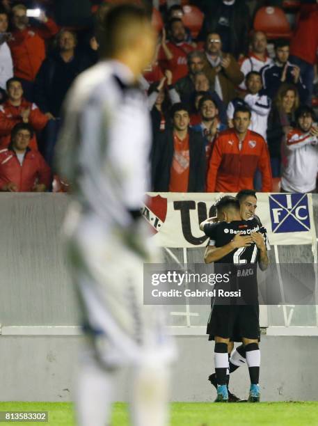 Leandro Miguel Fernandez of Independiente celebrates with teammates after scoring the third goal of his team during the first leg match between...