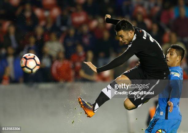 Nery Andres Dominguez of Independiente kicks the ball to score the fourth goal of his team during the first leg match between Independiente and...