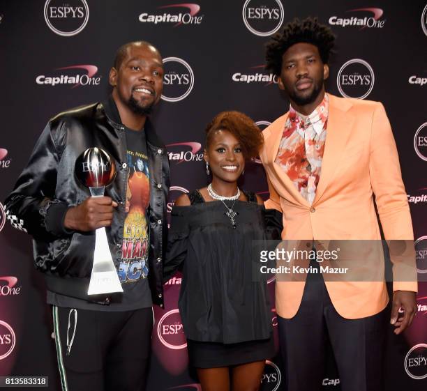 Player Kevin Durant, winner of the Best Championship Performance award, actor Issa Rae, and NBA player Joel Embiid attend The 2017 ESPYS at Microsoft...
