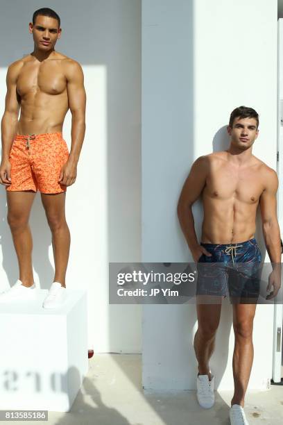 Models pose at the Thorsun Men's and Women's Spring/Summer 2018 presentation on July 12, 2017 in New York City.