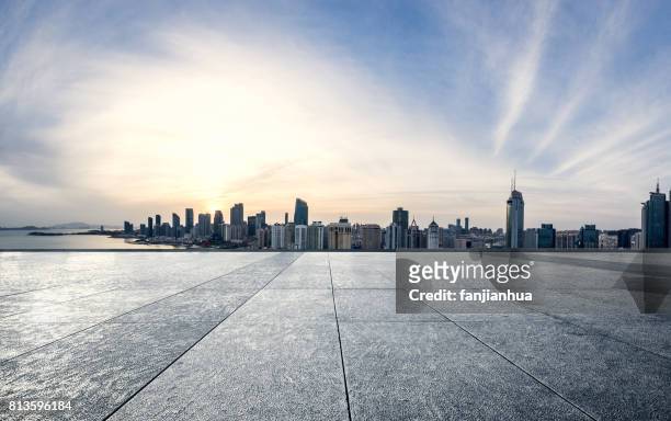 empty brick platform with shanghai city in the background at sunrise/sunset - platform shoe stock pictures, royalty-free photos & images