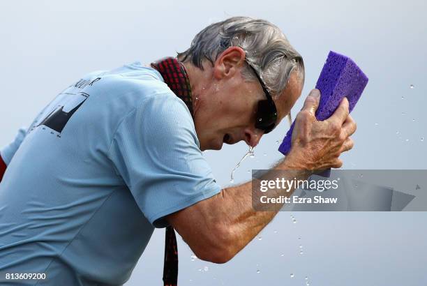 David Jones covers himself with water during the STYR Labs Badwater 135 on July 12, 2017 in Death Valley, California. The start of the 135 mile race...