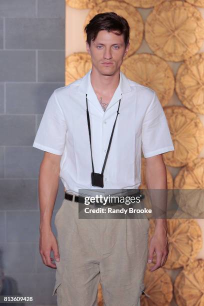 Model walks the runway during the Deveaux Presentation NYFW: Men's July 2017 on July 12, 2017 in New York City.