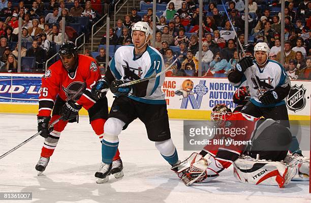 Hockey: San Jose Sharks Mike Grier and goalie Martin Biron in action vs Buffalo Sabres Scott Thornton and Jonathan Cheechoo , Buffalo, NY 12/2/2005