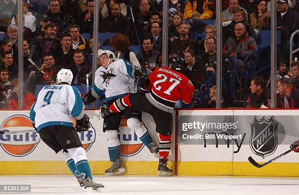 Hockey: San Jose Sharks Doug Murray in action during check vs Buffalo Sabres Teppo Numminen , Buffalo, NY 12/2/2005