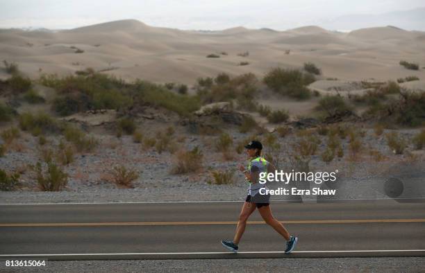 An athlete runs past the Mesquite Flat Sand Dunes during the STYR Labs Badwater 135 on July 12, 2017 in Death Valley, California. The start of the...