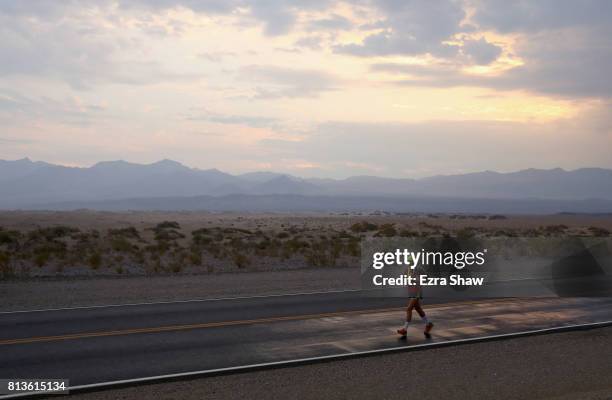 An athlete runs past the Mesquite Flat Sand Dunes during the STYR Labs Badwater 135 on July 12, 2017 in Death Valley, California. The start of the...