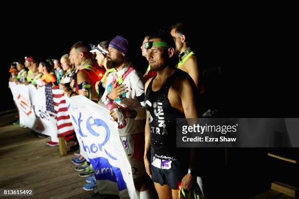Oswaldo Lopez stands for teh National Anthem before the start of the STYR Labs Badwater 135 on July 11, 2017 in Death Valley, California. Lopez, who...