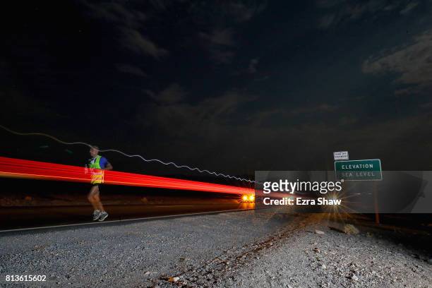 An athlete runs at night during the STYR Labs Badwater 135 on July 12, 2017 in Death Valley, California. The start of the 135 mile race is at...