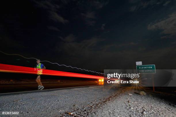 An athlete runs at night during the STYR Labs Badwater 135 on July 12, 2017 in Death Valley, California. The start of the 135 mile race is at...