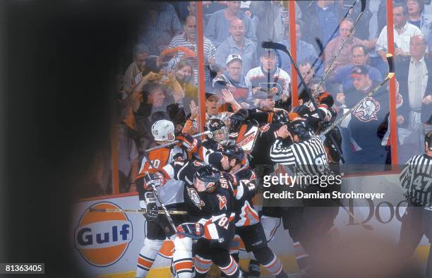 Hockey: NHL Playoffs, Referee Brad Lazarowich attempting to break up fight between Philadelphia Flyers Keith Jones , John LeClair and Buffalo Sabres...
