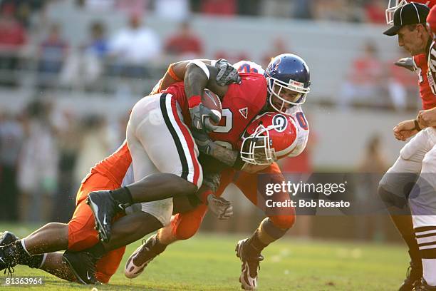 College Football: Boise State Marty Tadman in action, making tackle vs Georgia Thomas Brown , Athens, GA 9/3/2005