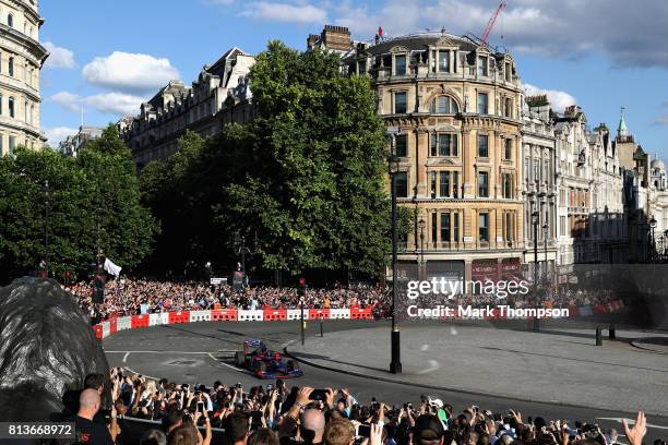 Carlos Sainz of Spain and Scuderia Toro Rosso driving the Scuderia Toro Rosso STR8 during F1 Live London at Trafalgar Square on July 12, 2017 in...