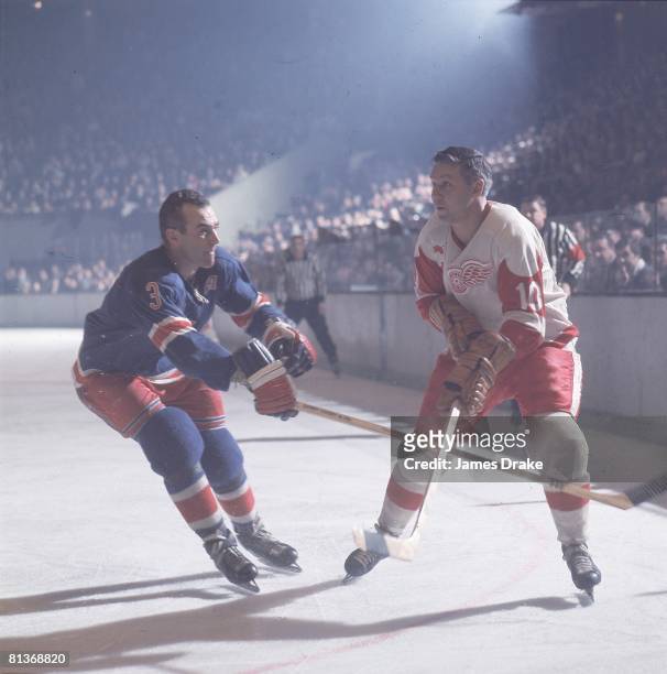 Hockey: Detroit Red Wings Alex Delvecchio in action vs New York Rangers Harry Howell, 1/1/1967--3/31/1967