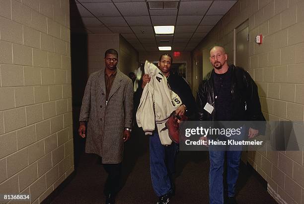 Basketball: Philadelphia 76ers Allen Iverson with bodyguards after game, Philadelphia, PA 1/14/1998