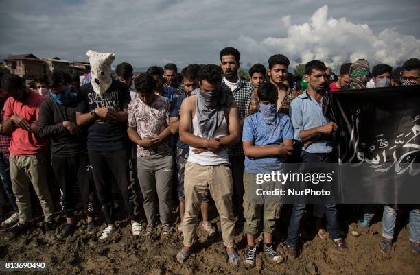 Kashmiri people offer funeral prayers to a local rebel Sajad Gilkar Wednesday, July 12, 2017 in Srinagar, Indian-administered Kashmir, India....