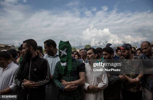 Kashmiri people offer funeral prayers to a local rebel Sajad Gilkar Wednesday, July 12, 2017 in Srinagar, Indian-administered Kashmir, India....