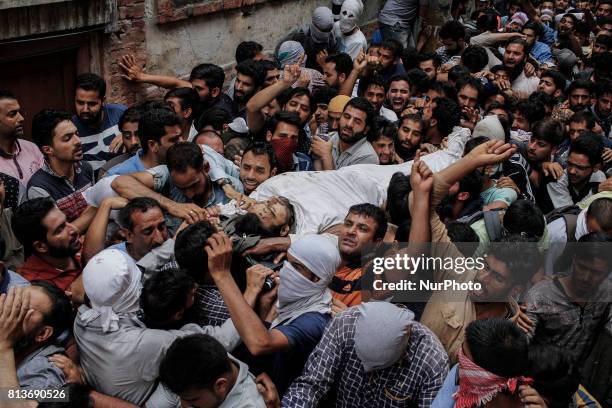 Kashmiri men carry the body of a local rebel Sajad Gilkar during his funeral Wednesday, July 12, 2017 in Srinagar, Indian-administered Kashmir,...