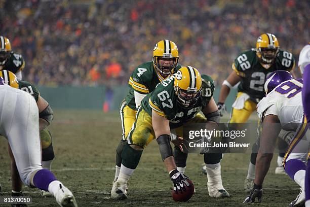 Football: NFC playoffs, Green Bay Packers QB Brett Favre and Grey Ruegamer calling siqnals before snap during game vs Minnesota Vikings Green Bay, WI...