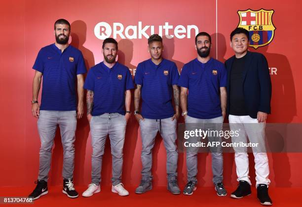 Barcelona football players Gerard Pique, Lionel Messi, Neymar, Arda Turan, and Rakuten CEO Hiroshi Mikitani pose for the media prior to a party in...