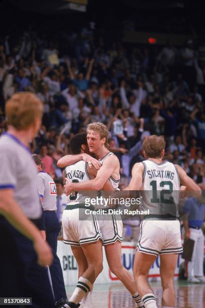 Basketball: NBA Playoffs, Boston Celtics Larry Bird victorious, hugging Dennis Johnson after Johnson made game winning layup on Bird's steal off...