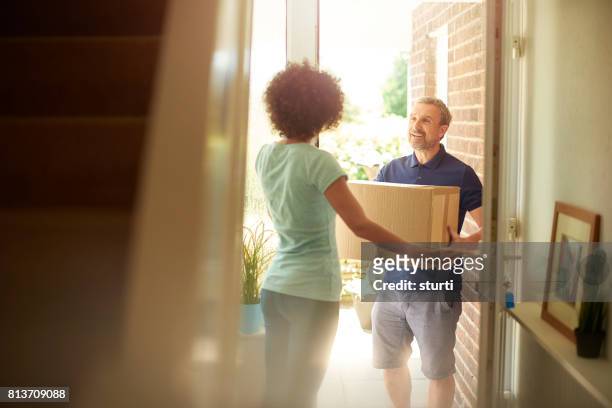 man at the door - dog greeting stock pictures, royalty-free photos & images