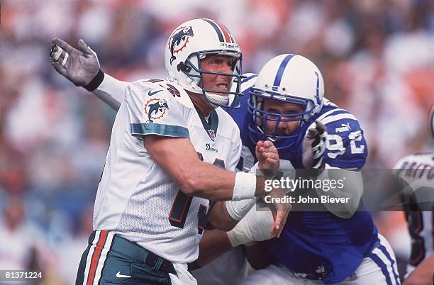 Football: Closeup of Miami Dolphins QB Dan Marino in action, making pass vs Indianapolis Colts Chad Bratzke , Miami, FL 12/5/1999