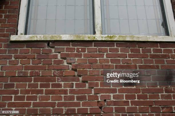Crack sits on the exterior wall of a house affected by fracking in Woldendorp, Groningen, Netherlands, on Thursday, June 29, 2017. It took officials...