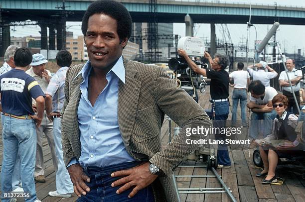 Football: Closeup casual view of San Francisco 49ers O,J, Simpson on movie set of "Fire Fight," Bridgeport, CT 6/27/1978