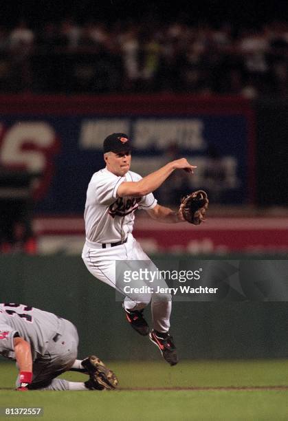 Baseball: Baltimore Orioles Cal Ripken Jr, in action, making throw and tying Lou Gehrig's 2130 consecutive game record vs California Angels,...