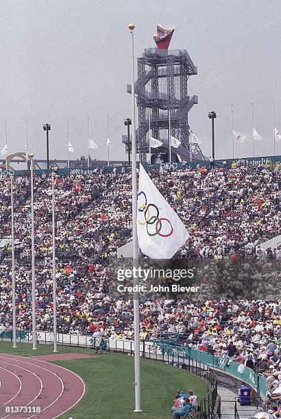 Terrorist Bombing: 1996 Summer Olympics, View of Olympic flags at half mast memorializing death and injuries suffered during bomb explosion at...