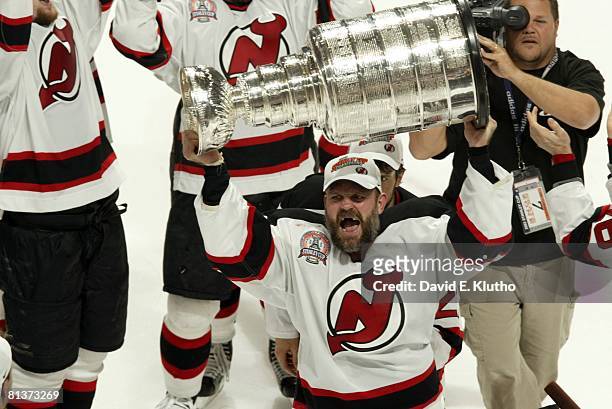 Hockey: NHL Finals, New Jersey Devils Ken Daneyko victorious with trophy after winning game vs Anaheim Mighty Ducks, Game 7, East Rutherford, NJ...