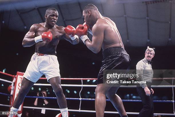 Boxing: WBC/WBA/IBF Heavyweight Title, James Buster Douglas in action, throwing punch vs Mike Tyson at Tokyo Dome, Tokyo, Japan 2/11/1990