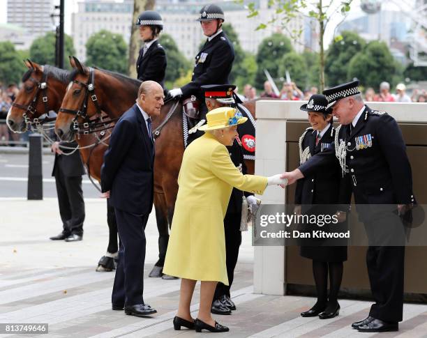 Queen Elizabeth II and Prince Philip, Duke of Edinburgh are welcomed to New Scotland Yard by Metropolitan Police commissioner Cressida Dick and...