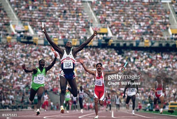 Track & Field: 1992 Summer Olympics, USA Carl Lewis victorious after winning 4X100M relay gold medal and setting new world record, Barcelona, ESP...